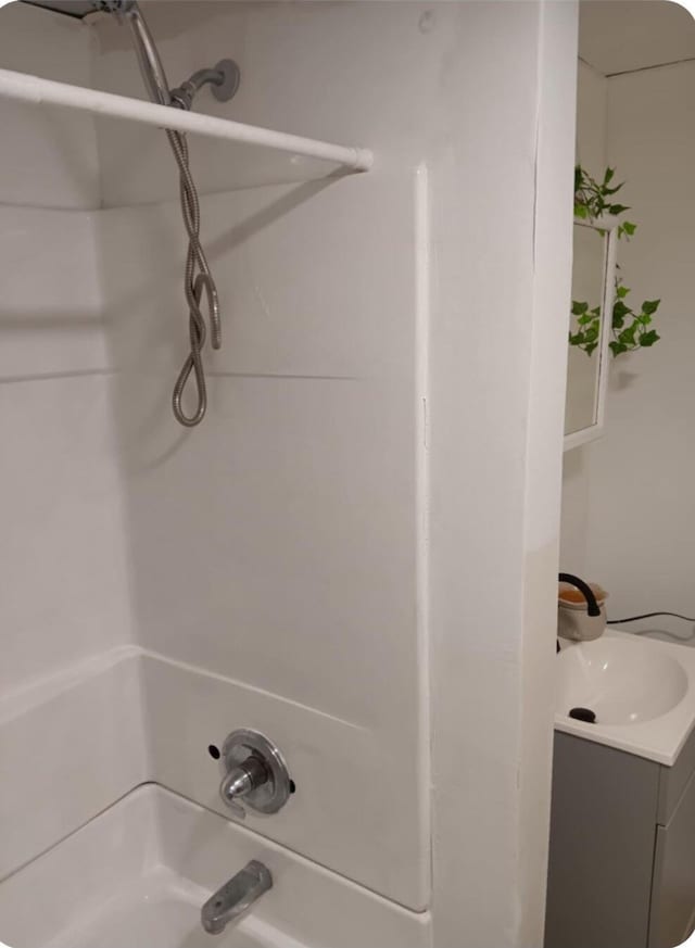 bathroom featuring vanity and shower / bathtub combination