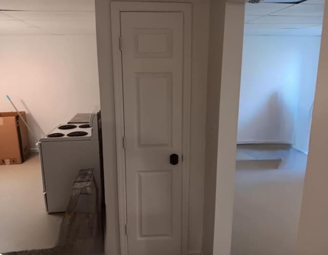details featuring white electric range and a paneled ceiling