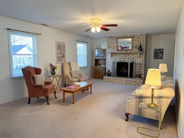 living room featuring a textured ceiling, carpet floors, a brick fireplace, and ceiling fan