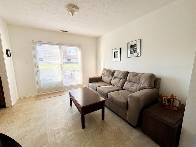 living room featuring a textured ceiling