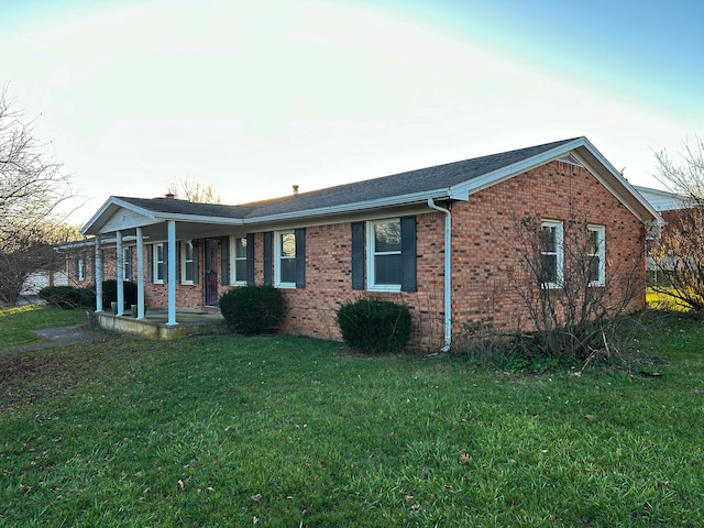 view of front of home featuring a front yard and a porch