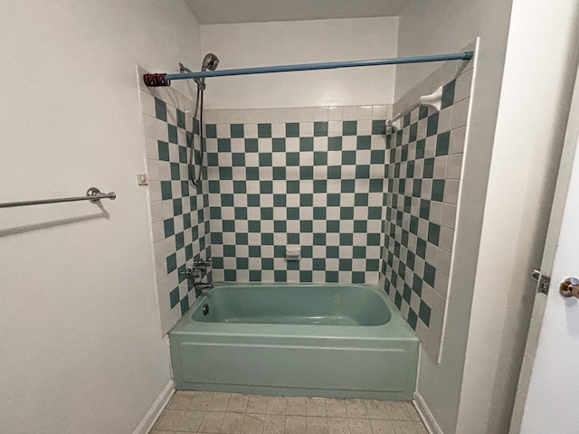 bathroom with tile patterned flooring and tiled shower / bath