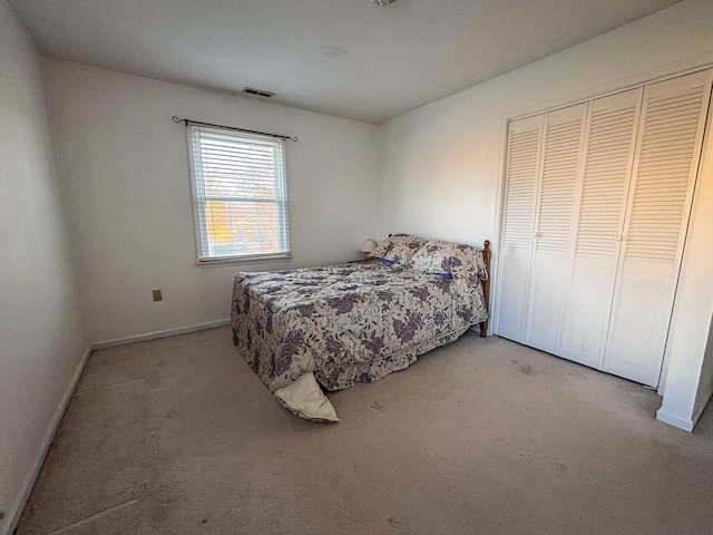 carpeted bedroom featuring a closet