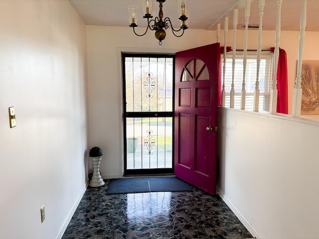 entrance foyer with a chandelier