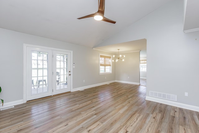 interior space featuring light wood-style floors, visible vents, baseboards, and ceiling fan with notable chandelier