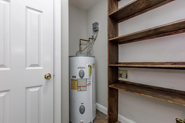 utility room featuring water heater