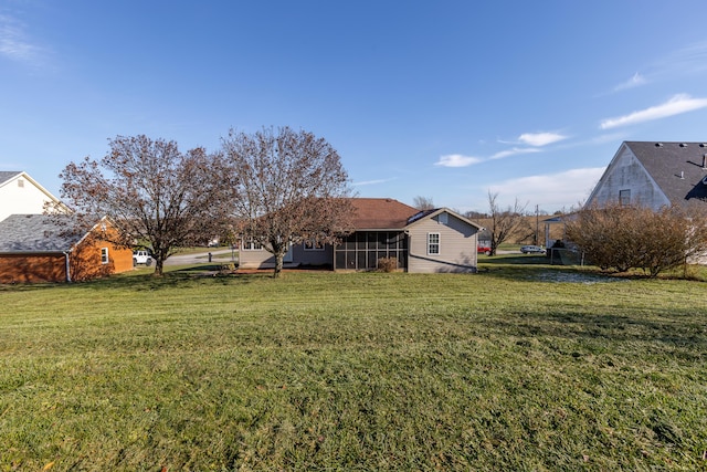 view of yard featuring a sunroom