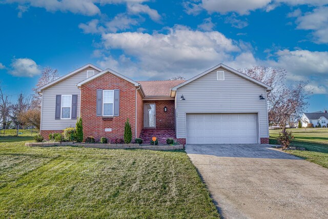 view of front of house with a front yard and a garage