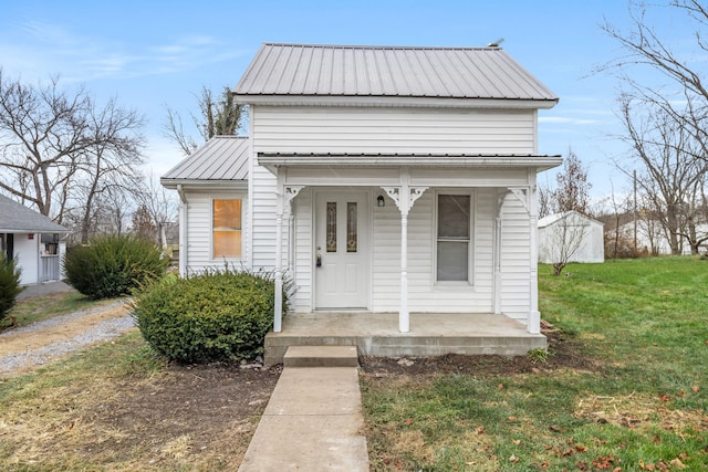 bungalow with a porch and a front yard