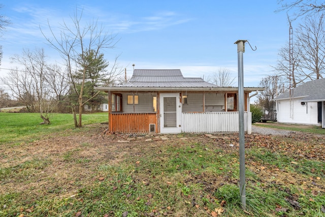 view of front of house with a front yard and a porch