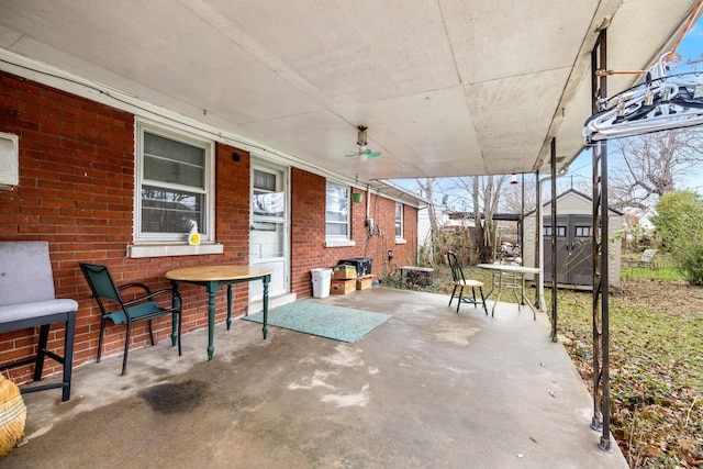 view of patio with a shed