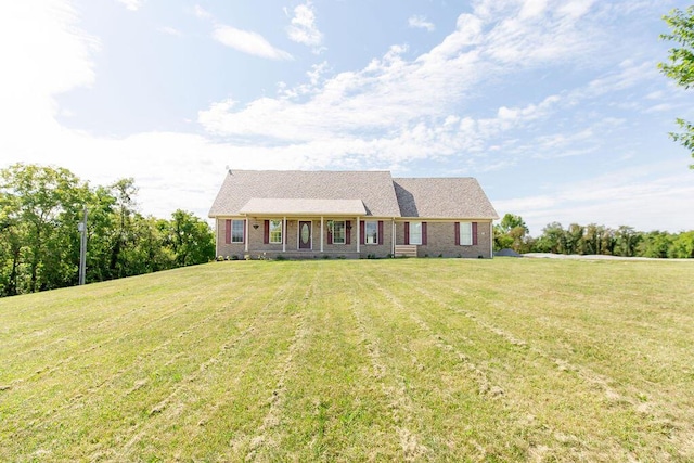 new england style home with a front lawn