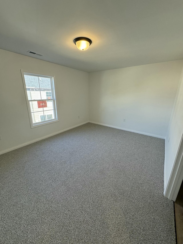 unfurnished room with carpet floors