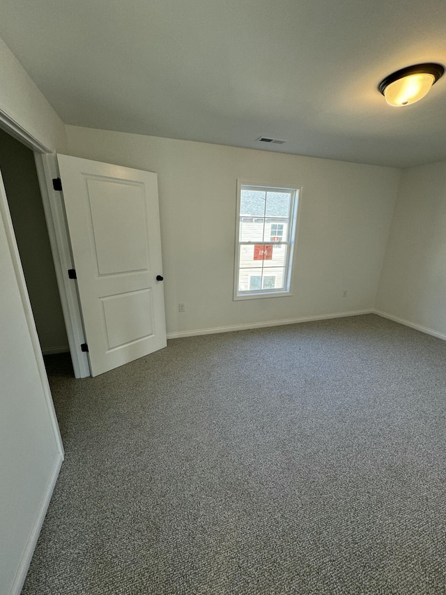 unfurnished room with carpet flooring