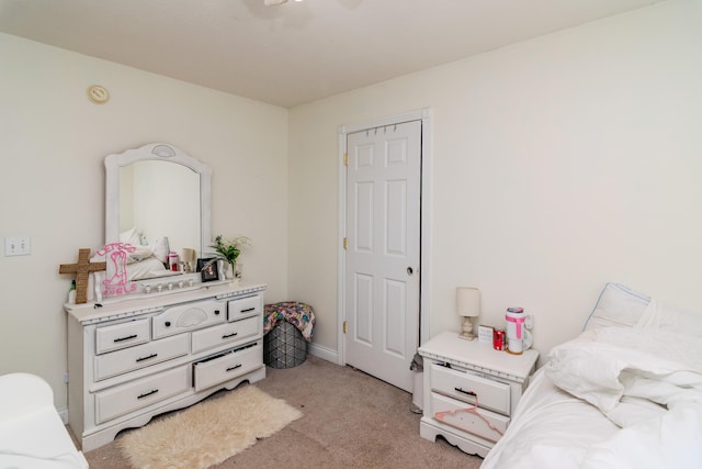 bedroom featuring light colored carpet