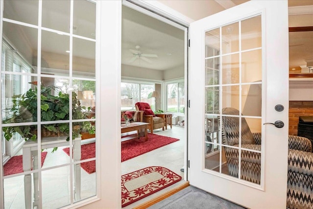 doorway featuring ceiling fan