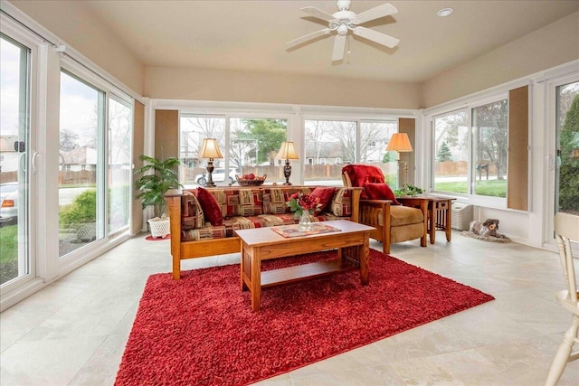 sunroom featuring a wealth of natural light and ceiling fan