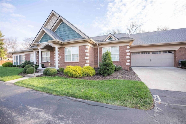 view of front facade featuring a garage and a front yard