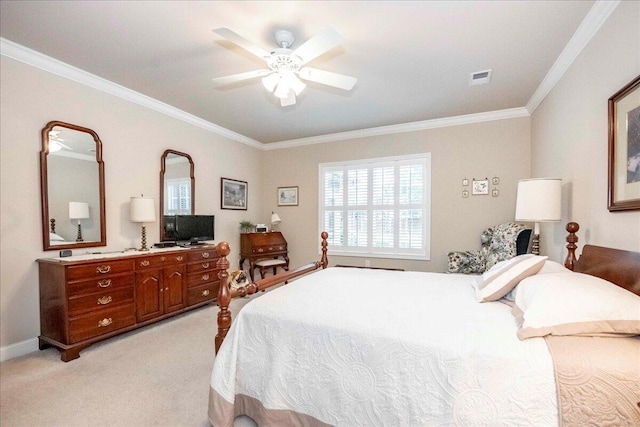 carpeted bedroom with ceiling fan and ornamental molding