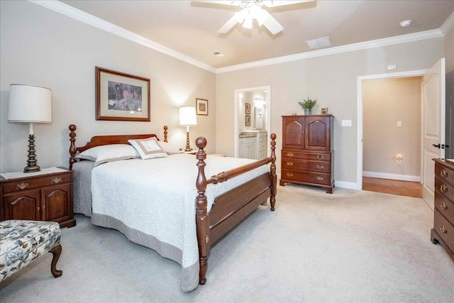 carpeted bedroom with ensuite bath, ceiling fan, and ornamental molding