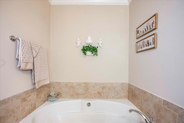 bathroom with a bathtub and ornamental molding