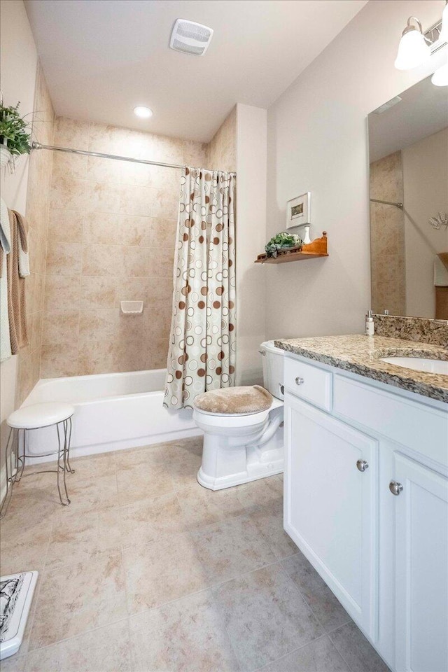 full bathroom featuring vanity, toilet, and shower / tub combo