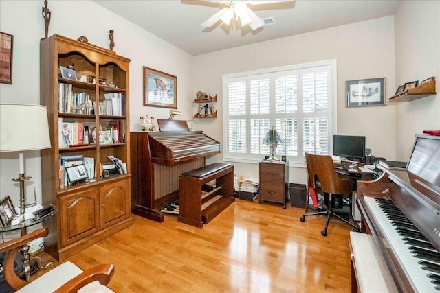 office featuring ceiling fan and light hardwood / wood-style flooring