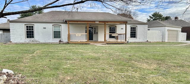 view of front facade with a front lawn and covered porch