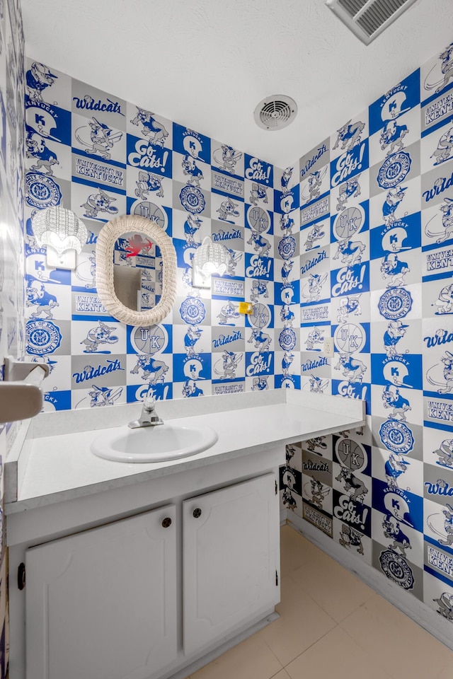 bathroom featuring tile patterned flooring and vanity