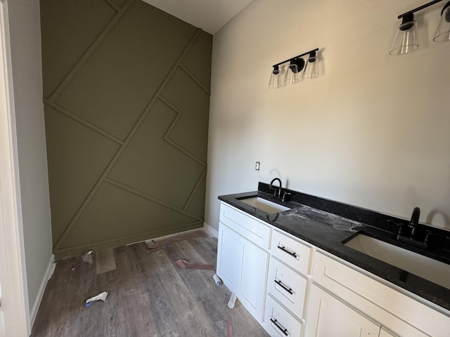 bathroom featuring a shower, hardwood / wood-style floors, and vanity