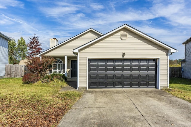 view of front facade with a garage and a front lawn