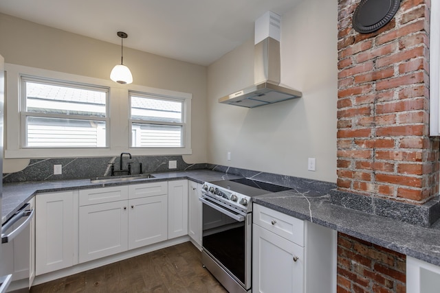 kitchen featuring dark hardwood / wood-style flooring, wall chimney exhaust hood, stainless steel appliances, sink, and plenty of natural light