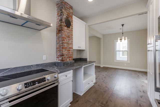 kitchen with white cabinets, dark hardwood / wood-style flooring, wall chimney exhaust hood, and stainless steel range with electric stovetop