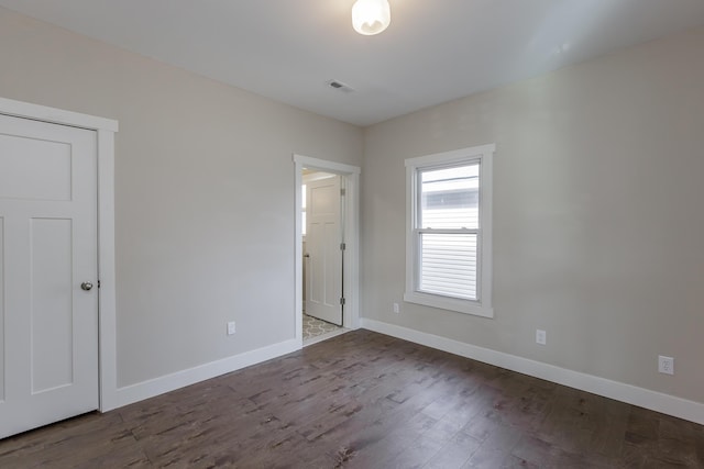 spare room with hardwood / wood-style flooring