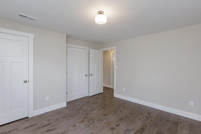 unfurnished bedroom with wood-type flooring