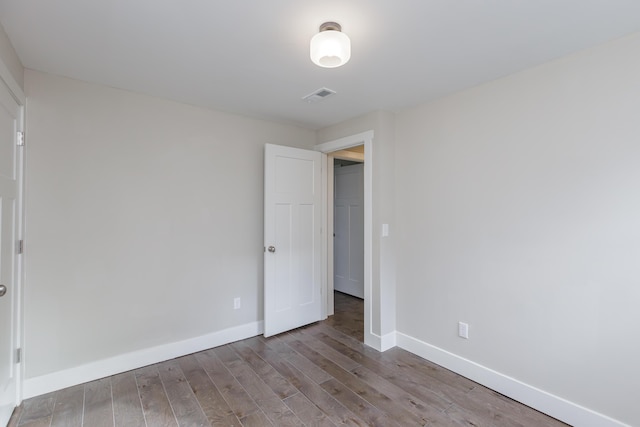 spare room with light hardwood / wood-style flooring