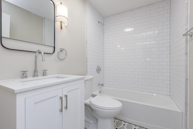 full bathroom with tile patterned flooring, vanity, toilet, and tiled shower / bath