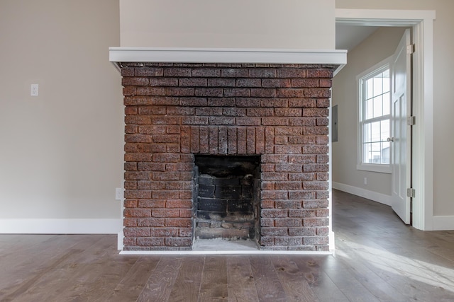 interior details with hardwood / wood-style floors and a fireplace