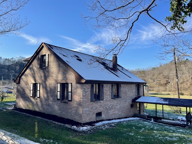 view of side of property with a yard