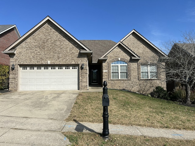 view of front facade featuring a garage and a front lawn