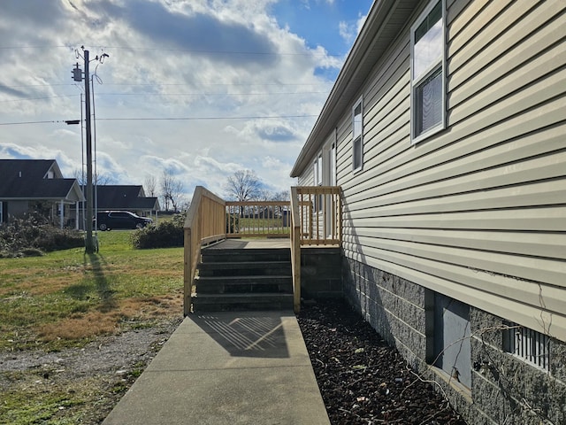 view of side of home featuring a deck