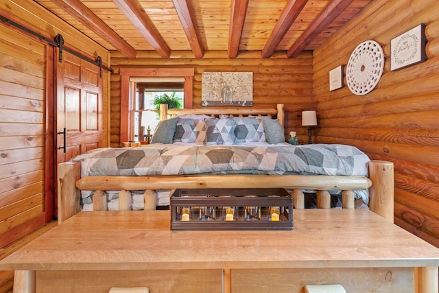 bedroom with a barn door, wooden ceiling, beam ceiling, and log walls