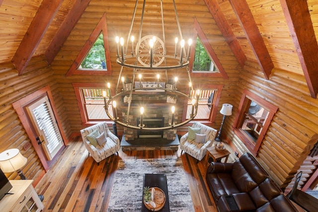 unfurnished living room with high vaulted ceiling, an inviting chandelier, hardwood / wood-style flooring, beamed ceiling, and wood ceiling