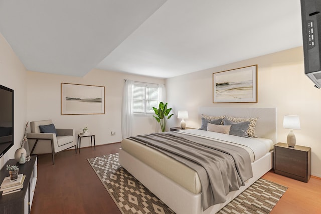 bedroom with hardwood / wood-style floors