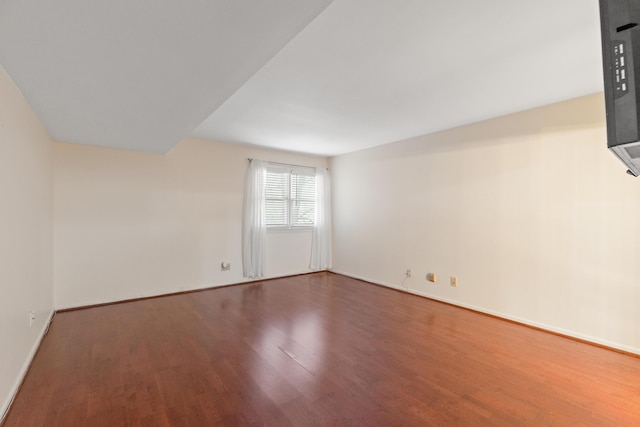 empty room with wood-type flooring