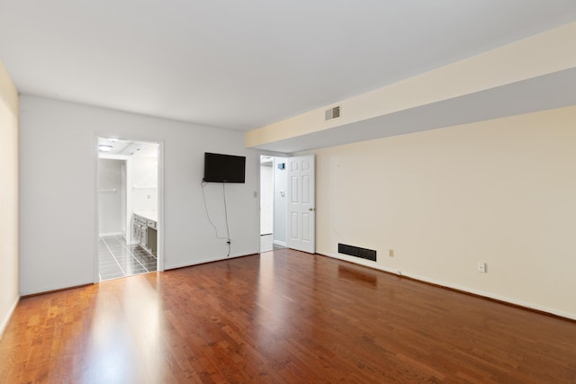 empty room with hardwood / wood-style flooring