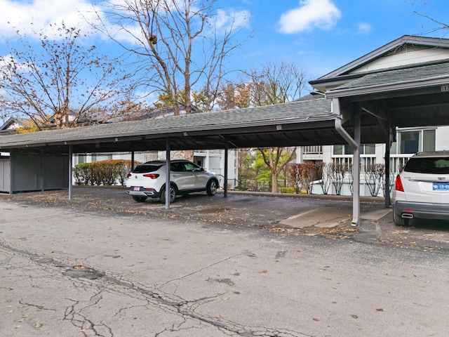 view of vehicle parking featuring a carport