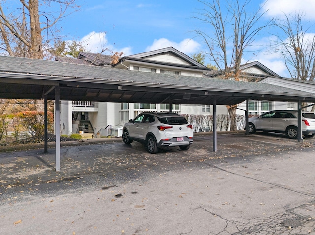 view of parking / parking lot featuring a carport