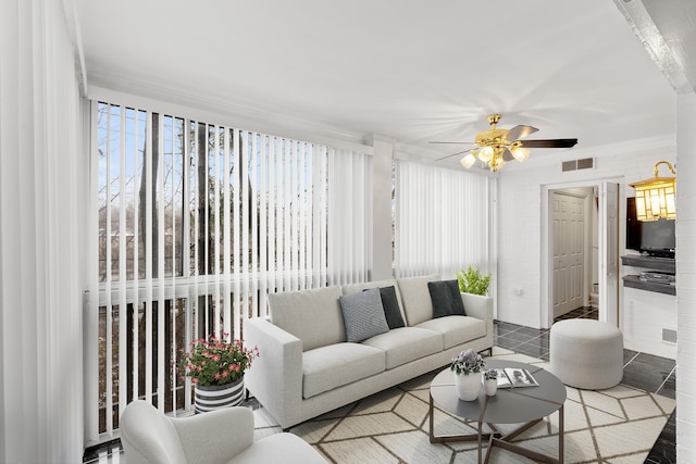 living room featuring tile patterned flooring, a wealth of natural light, and ceiling fan