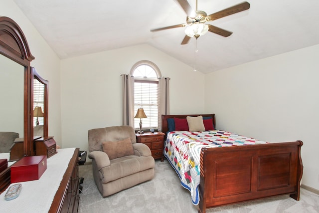 bedroom with ceiling fan, light carpet, and vaulted ceiling